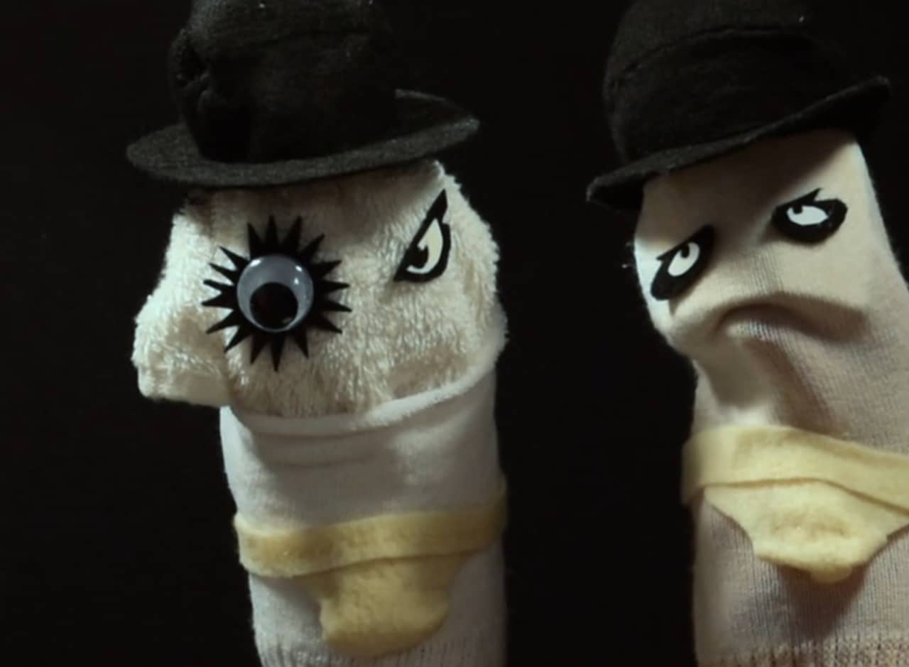 sock puppets decorated like the characters from a Clockwork Orange